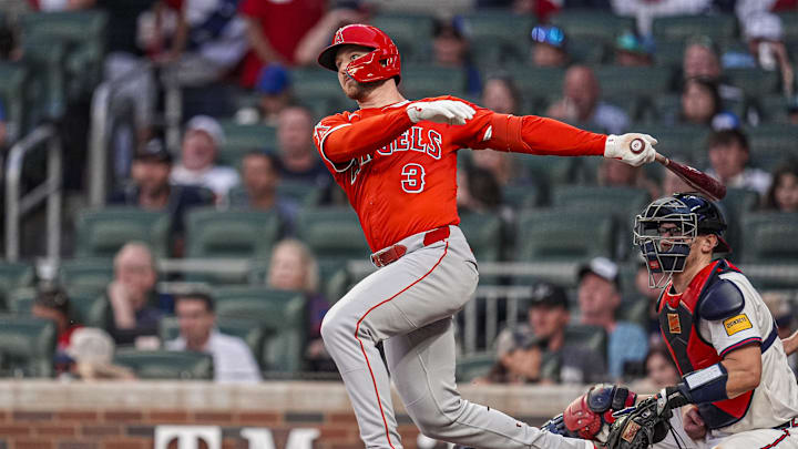 Jul 3, 2025; Cumberland, Georgia, USA; Los Angeles Angels left fielder Taylor Ward (3) follows through after hitting a triple to drive in a run against the Atlanta Braves during the sixth inning at Truist Park. Mandatory Credit: Dale Zanine-Imagn Images