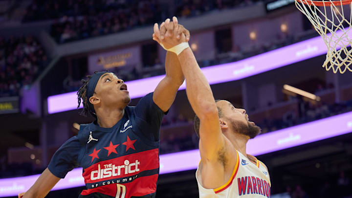 Jan 18, 2025; San Francisco, California, USA; Washington Wizards guard Bilal Coulibaly (0) defends against a shot by Golden State Warriors guard Stephen Curry (30) during the fourth quarter at Chase Center. Mandatory Credit: Robert Edwards-Imagn Images Jan 18, 2025; San Francisco, California, USA; Washington Wizards guard Bilal Coulibaly (0) defends against a shot by Golden State Warriors guard Stephen Curry (30) during the fourth quarter at Chase Center. Mandatory Credit: Robert Edwards-Imagn Images
