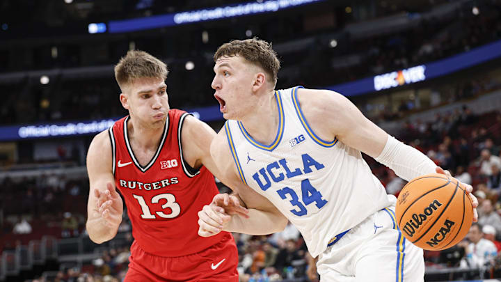 Mar 12, 2026; Chicago, IL, USA; UCLA Bruins forward Tyler Bilodeau (34) drives to the basket against Rutgers Scarlet Knights guard Harun Zrno (13) during the second half at United Center. Mandatory Credit: Kamil Krzaczynski-Imagn Images