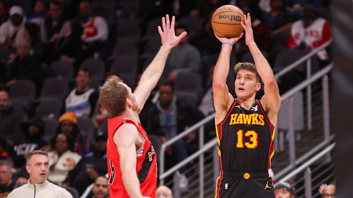 Jan 23, 2025; Atlanta, Georgia, USA; Atlanta Hawks guard Bogdan Bogdanovic (13) shoots against the Toronto Raptors in the second quarter at State Farm Arena. Mandatory Credit: Brett Davis-Imagn Images