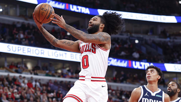 Jan 10, 2026; Chicago, Illinois, USA; Chicago Bulls guard Coby White (0) goes to the basket against the Dallas Mavericks during the first half at United Center. Mandatory Credit: Kamil Krzaczynski-Imagn Images