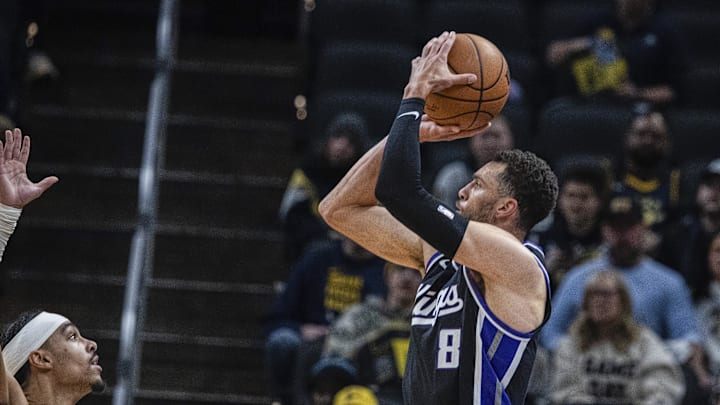 Dec 8, 2025; Indianapolis, Indiana, USA; Sacramento Kings guard Zach Lavine (8) shoots the ball while  Indiana Pacers guard Andrew Nembhard (2) defends in the first half at Gainbridge Fieldhouse. Mandatory Credit: Trevor Ruszkowski-Imagn Images