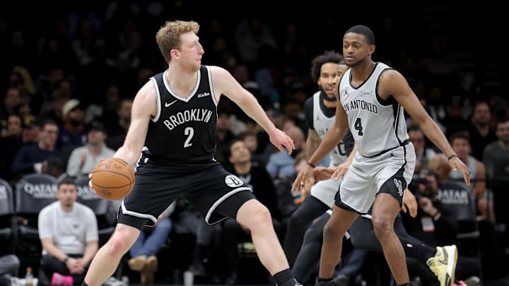 Feb 26, 2026; Brooklyn, New York, USA; Brooklyn Nets forward Danny Wolf (2) looks to pass the ball against San Antonio Spurs guard De'aaron Fox (4) during the second quarter at Barclays Center. Mandatory Credit: Brad Penner-Imagn Images