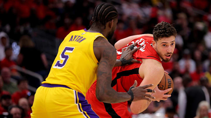 May 1, 2026; Houston, Texas, USA; Houston Rockets center Alperen Sengun (28) handles the ball against Los Angeles Lakers center Deandre Ayton (5) during the second quarter of game six of the first round of the 2026 NBA Playoffs at Toyota Center. Mandatory Credit: Erik Williams-Imagn Images