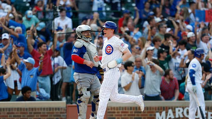 Aug 6, 2026; Chicago, Illinois, USA; Chicago Cubs designated hitter Pete Crow-Armstrong (4) scores against the Toronto Blue Jays during the ninth inning at Wrigley Field. Mandatory Credit: Kamil Krzaczynski-Imagn Images