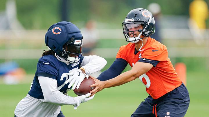 Chicago Bears quarterback Caleb Williams (18) hands the ball off to running back Kyle Monangai (25) during training camp at Halas Hall. Mandatory Credit: Kamil Krzaczynski-Imagn Images Chicago Bears quarterback Caleb Williams (18) hands the ball off to running back Kyle Monangai (25) during training camp at Halas Hall. Mandatory Credit: Kamil Krzaczynski-Imagn Images