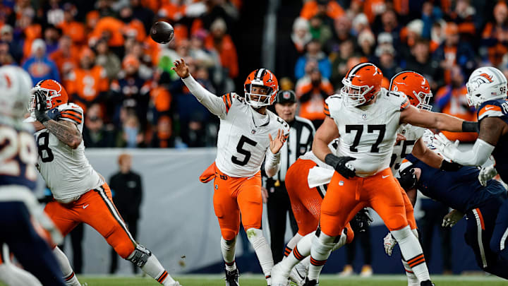 Dec 2, 2024; Denver, Colorado, USA; Cleveland Browns quarterback Jameis Winston (5) attempts a pass as guard Wyatt Teller (77) defends in the second quarter against the Denver Broncos at Empower Field at Mile High. Mandatory Credit: Isaiah J. Downing-Imagn Images
