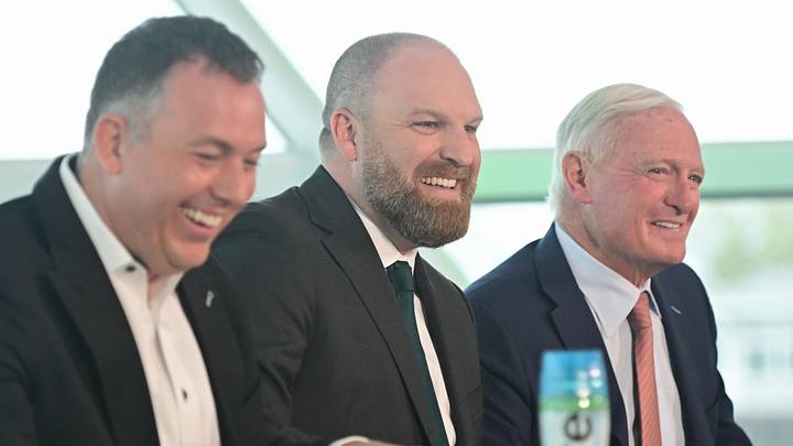Milwaukee Bucks general manager Jon Horst (left) and co-owner Jimmy Haslam (right) introduce new head coach Taylor Jenkins (center) at a press conference at Milwaukee Art Museum on May 6, 2026.