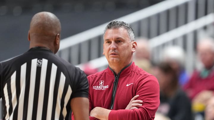 Dec 21, 2024; San Jose, California, USA; Stanford Cardinal head coach Kyle Smith (right) talks to a referee during the first half against the Oregon Ducks at SAP Center at San Jose. Mandatory Credit: Darren Yamashita-Imagn Images Dec 21, 2024; San Jose, California, USA; Stanford Cardinal head coach Kyle Smith (right) talks to a referee during the first half against the Oregon Ducks at SAP Center at San Jose. Mandatory Credit: Darren Yamashita-Imagn Images