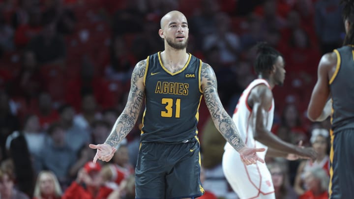 Dec 13, 2022; Houston, Texas, USA; North Carolina A&T Aggies forward Duncan Powell (31) reacts after a play during the first half against the Houston Cougars at Fertitta Center. Mandatory Credit: Troy Taormina-USA TODAY Sports Dec 13, 2022; Houston, Texas, USA; North Carolina A&T Aggies forward Duncan Powell (31) reacts after a play during the first half against the Houston Cougars at Fertitta Center. Mandatory Credit: Troy Taormina-USA TODAY Sports