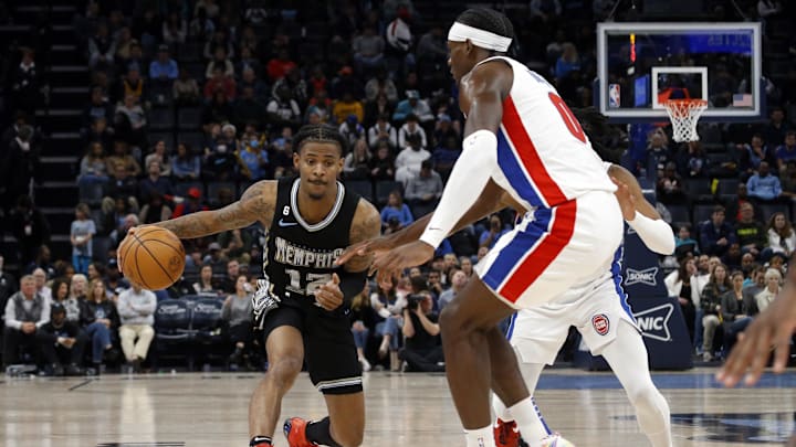Dec 9, 2022; Memphis, Tennessee, USA; Memphis Grizzlies guard Ja Morant (12) dribbles as Detroit Pistons center Jalen Duren (0) defends during the second half at FedExForum. Mandatory Credit: Petre Thomas-Imagn Images Dec 9, 2022; Memphis, Tennessee, USA; Memphis Grizzlies guard Ja Morant (12) dribbles as Detroit Pistons center Jalen Duren (0) defends during the second half at FedExForum. Mandatory Credit: Petre Thomas-Imagn Images