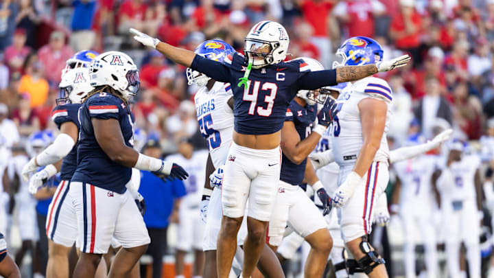 Nov 8, 2025; Tucson, Arizona, USA; Arizona Wildcats defensive back Dalton Johnson (43) celebrates a missed field goal by the Kansas Jayhawks in the second half at Arizona Stadium. Mandatory Credit: Mark J. Rebilas-Imagn Images