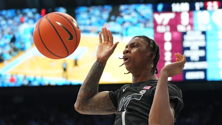 Feb 28, 2026; Chapel Hill, North Carolina, USA; Virginia Tech Hokies forward Tobi Lawal (1) scores in the first half at Dean E. Smith Center. Mandatory Credit: Bob Donnan-Imagn Images