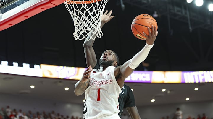 Feb 27, 2024; Houston, Texas, USA; Houston Cougars guard Jamal Shead (1) shoots the ball during the
