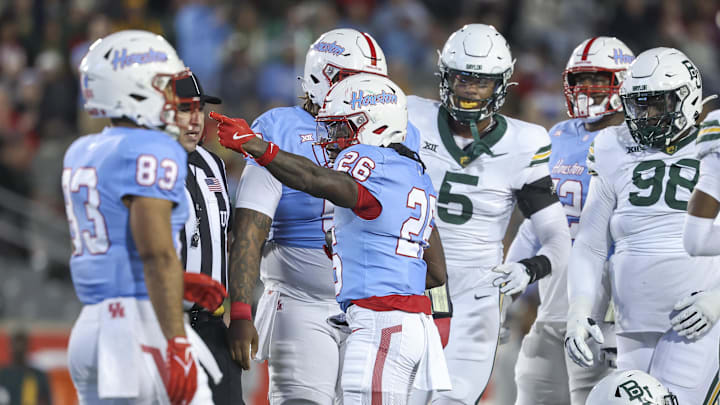 Nov 23, 2024; Houston, Texas, USA; Houston Cougars running back Re'Shaun Sanford II (26) signals for a first down after a play during the first quarter against the Baylor Bears at TDECU Stadium. Mandatory Credit: Troy Taormina-Imagn Images