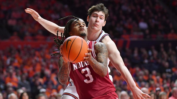 Feb 15, 2026; Champaign, Illinois, USA; Indiana Hoosiers guard Lamar Wilkerson (3) keeps the ball from Illinois Fighting Illini forward David Mirkovic (0) during the second half at State Farm Center. Mandatory Credit: Ron Johnson-Imagn Images