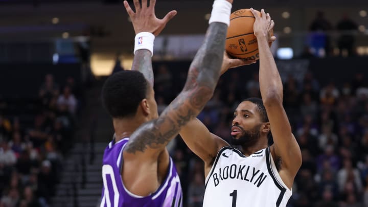 Dec 18, 2023; Salt Lake City, Utah, USA; Brooklyn Nets forward Mikal Bridges (1) shoots over Utah Jazz forward John Collins (20) during the fourth quarter at Delta Center. Mandatory Credit: Rob Gray-USA TODAY Sports