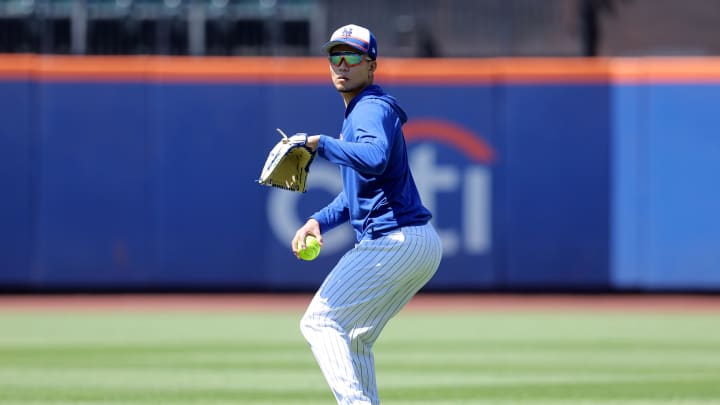 Jun 1, 2024; New York City, New York, USA; New York Mets injured starting pitcher Kodai Senga (34) throws a softball in the outfield before a game against the Arizona Diamondbacks at Citi Field. Mandatory Credit: Brad Penner-USA TODAY Sports