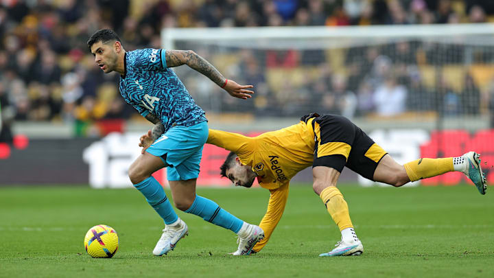 Pedro Neto tries and fails to get the ball of Cristian Romero - Wolverhampton Wanderers v Tottenham Hotspur - Premier League