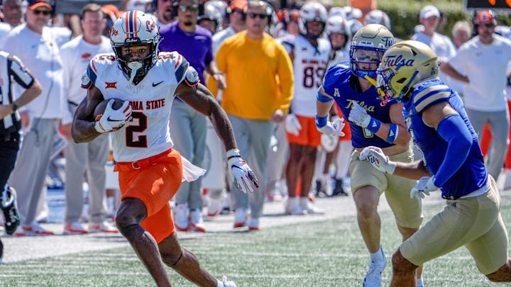 Oklahoma State wide receiver Talyn Shettron (2) catches a pass and runs up field in the second half during an NCAA football game between Oklahoma State and Tulsa in Tulsa, Okla., on Saturday, Sept. 14, 2024.