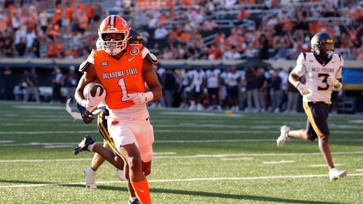Oklahoma State Cowboys wide receiver De'Zhaun Stribling (1) scores a touchdown during a college football game between the Oklahoma State Cowboys (OSU) and the West Virginia Mountaineers at Boone Pickens Stadium in Stillwater, Okla., Saturday, Oct. 5, 2024.
