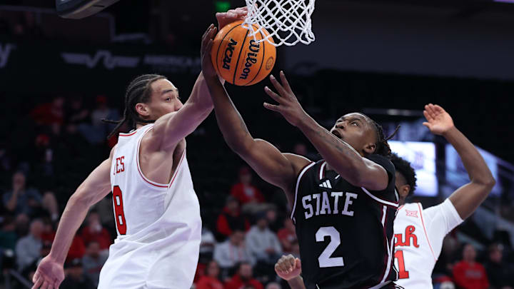 Mississippi State Bulldogs guard Ja'Borri McGhee (2) has a shot blocked by Utah Utes forward Keanu Dawes (8) during the first half at Delta Center. 