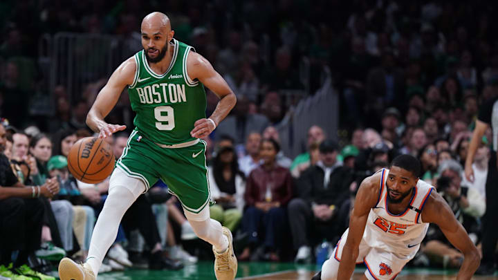 May 7, 2025; Boston, Massachusetts, USA; Boston Celtics guard Derrick White (9) and New York Knicks forward Mikal Bridges (25) work for the ball in the second quarter during game two of the second round for the 2025 NBA Playoffs at TD Garden. Mandatory Credit: David Butler II-Imagn Images