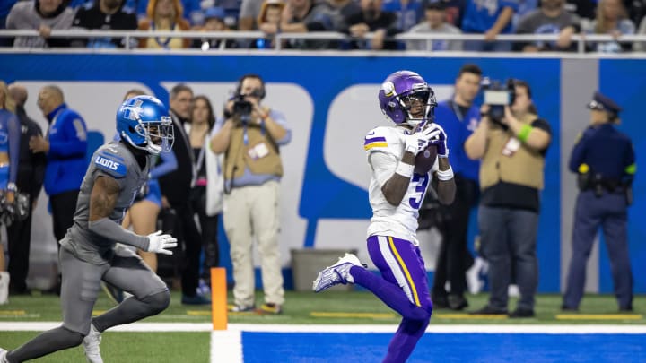 Jan 7, 2024; Detroit, Michigan, USA; Minnesota Vikings wide receiver Jordan Addison (3) catches a pass for a touchdown in front of Detroit Lions cornerback Cameron Sutton (1) during second half at Ford Field. Mandatory Credit: David Reginek-USA TODAY Sports