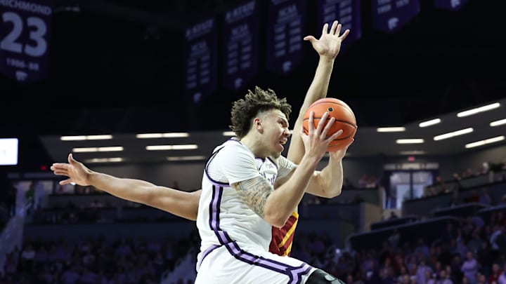 Mar 8, 2025; Manhattan, Kansas, USA; Kansas State Wildcats forward Coleman Hawkins (33) goes to the basket against Iowa State Cyclones center Dishon Jackson (1) during the first half at Bramlage Coliseum. Mandatory Credit: Scott Sewell-Imagn Images Mar 8, 2025; Manhattan, Kansas, USA; Kansas State Wildcats forward Coleman Hawkins (33) goes to the basket against Iowa State Cyclones center Dishon Jackson (1) during the first half at Bramlage Coliseum. Mandatory Credit: Scott Sewell-Imagn Images