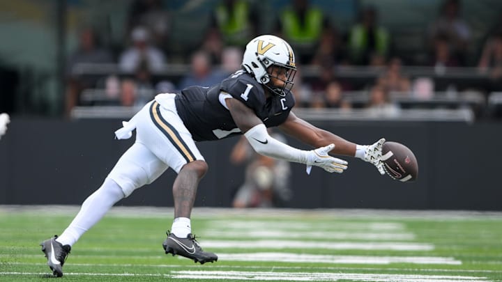 Aug 31, 2024; Nashville, Tennessee, USA;  Vanderbilt Commodores safety CJ Taylor (1) misses a chance at an interception against the Virginia Tech Hokies during the first half at FirstBank Stadium.