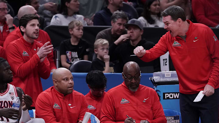 Mar 21, 2024; Salt Lake City, UT, USA;  Arizona Wildcats head coach Tommy Lloyd reacts during the first half against Long Beach State 49ers in the first round of the 2024 NCAA Tournament at Vivint Smart Home Arena-Delta Center. Mandatory Credit: Gabriel Mayberry-Imagn Images