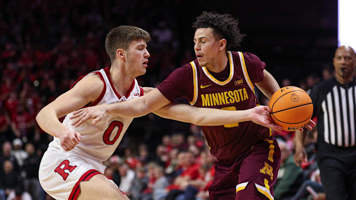 Mar 9, 2025; Piscataway, New Jersey, USA; Rutgers Scarlet Knights guard Jordan Derkack (0) deflects the ball away from Minnesota Golden Gophers guard Mike Mitchell Jr. (2) during the first half at Jersey Mike's Arena. Mandatory Credit: Vincent Carchietta-Imagn Images