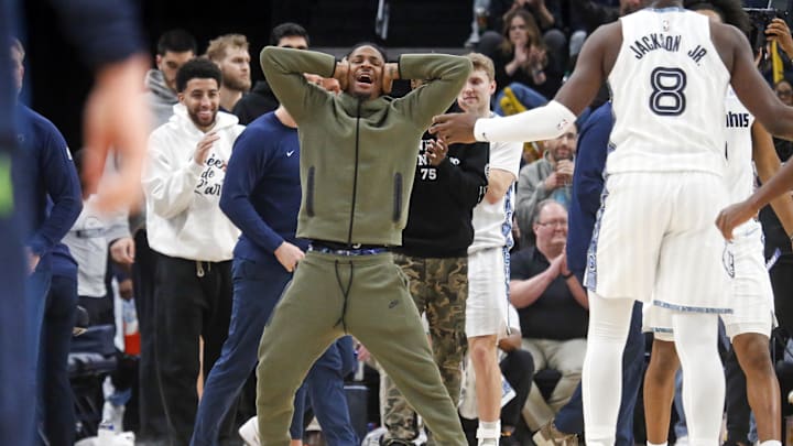 Feb 2, 2026; Memphis, Tennessee, USA; Memphis Grizzlies guard Ja Morant (12) reacts with forward/center Jaren Jackson Jr. (8) after a basket during the fourth quarter against the Minnesota Timberwolves at FedExForum. Mandatory Credit: Petre Thomas-Imagn Images