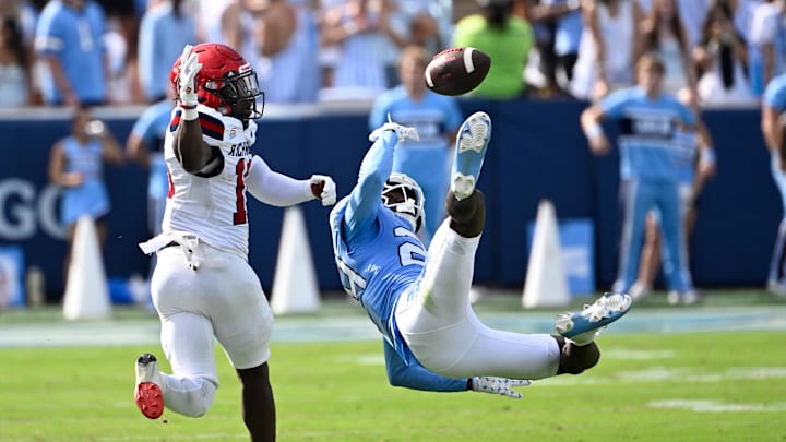 Sep 13, 2025; Chapel Hill, North Carolina, USA; North Carolina Tar Heels defensive lineman Joseph Mupoyi (25) breaks up the pass intended for Richmond Spiders wide receiver Isaiah Dawson (10) in the second quarter at Kenan Stadium. Sep 13, 2025; Chapel Hill, North Carolina, USA; North Carolina Tar Heels defensive lineman Joseph Mupoyi (25) breaks up the pass intended for Richmond Spiders wide receiver Isaiah Dawson (10) in the second quarter at Kenan Stadium.