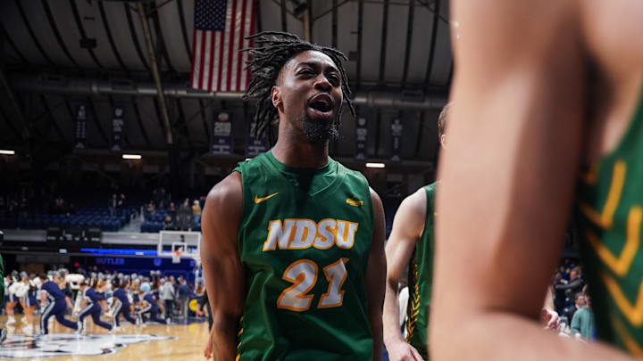 Dec 10, 2024; Indianapolis, Indiana, USA; North Dakota State Bison guard Tajavis Miller (21) celebrates after defeating the Butler Bulldogs at Hinkle Fieldhouse. Mandatory Credit: Robert Goddin-Imagn Images Dec 10, 2024; Indianapolis, Indiana, USA; North Dakota State Bison guard Tajavis Miller (21) celebrates after defeating the Butler Bulldogs at Hinkle Fieldhouse. Mandatory Credit: Robert Goddin-Imagn Images
