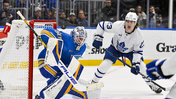 Nov 2, 2024; St. Louis, Missouri, USA;  St. Louis Blues goaltender Jordan Binnington (50) defends the net against Toronto Maple Leafs left wing Matthew Knies (23) during the third period at Enterprise Center. Mandatory Credit: Jeff Curry-Imagn Images