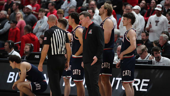 Jan 18, 2025; Lubbock, Texas, USA;  Arizona Wildcats head coach Tommy Lloyd questions Big 12 official Michael Greenstein at the end of the game against the Texas Tech Red Raiders at United Supermarkets Arena. Mandatory Credit: Michael C. Johnson-Imagn Images