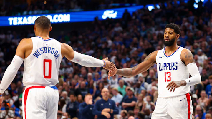 LA Clippers guard Russell Westbrook (0) and forward Paul George (13) during the second half against the Dallas Mavericks during game four of the first round for the 2024 NBA playoffs at American Airlines Center. LA Clippers guard Russell Westbrook (0) and forward Paul George (13) during the second half against the Dallas Mavericks during game four of the first round for the 2024 NBA playoffs at American Airlines Center.