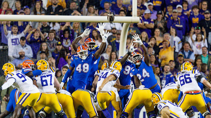 Nov 11, 2023; Baton Rouge, Louisiana, USA; LSU Tigers place kicker Damian Ramos (34) kicks a field goal against Florida Gators defensive end Quincy Ivory (48) and defensive end Kamran James (24) during the first half at Tiger Stadium. Mandatory Credit: Stephen Lew-Imagn Images Nov 11, 2023; Baton Rouge, Louisiana, USA; LSU Tigers place kicker Damian Ramos (34) kicks a field goal against Florida Gators defensive end Quincy Ivory (48) and defensive end Kamran James (24) during the first half at Tiger Stadium. Mandatory Credit: Stephen Lew-Imagn Images