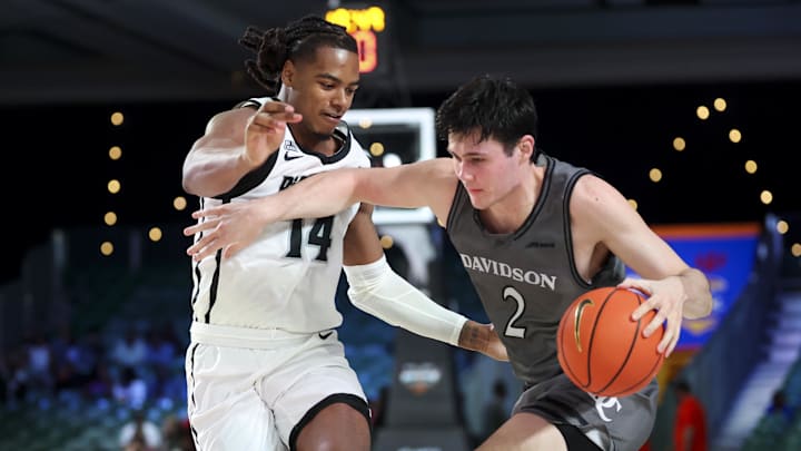 Nov 28, 2024; Paradise Island, Bahamas, BHS; Davidson Wildcats forward Bobby Durkin (2) drives to the basket as Providence Friars guard Corey Floyd Jr. (14) defends during the second half at the Imperial Arena at the Atlantis Resort. Mandatory Credit: Kevin Jairaj-Imagn Images Nov 28, 2024; Paradise Island, Bahamas, BHS; Davidson Wildcats forward Bobby Durkin (2) drives to the basket as Providence Friars guard Corey Floyd Jr. (14) defends during the second half at the Imperial Arena at the Atlantis Resort. Mandatory Credit: Kevin Jairaj-Imagn Images