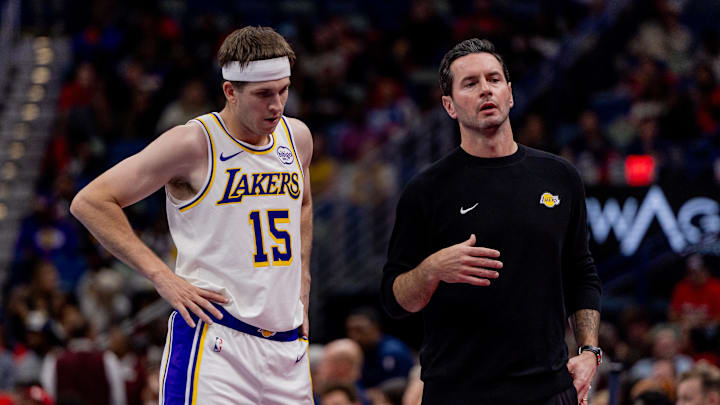 Nov 14, 2025; New Orleans, Louisiana, USA;  Los Angeles Lakers guard Austin Reaves (15) talks to Head Coach JJ Redick on a time out against the New Orleans Pelicans during the first half at Smoothie King Center. Mandatory Credit: Stephen Lew-Imagn Images