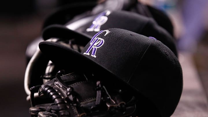 Apr 20, 2015; Denver, CO, USA; A general view of gloves and hats in the Colorado Rockies dugout during the fifth inning against the San Diego Padres at Coors Field. 