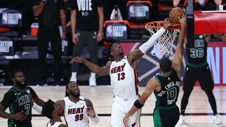 Sep 15, 2020; Lake Buena Vista, Florida, USA; Miami Heat forward Bam Adebayo (13) blocks a shot by Boston Celtics forward Jayson Tatum (0) during overtime in game one of the Eastern Conference Finals of the 2020 NBA Playoffs at ESPN Wide World of Sports Complex. Mandatory Credit: Kim Klement-Imagn Images