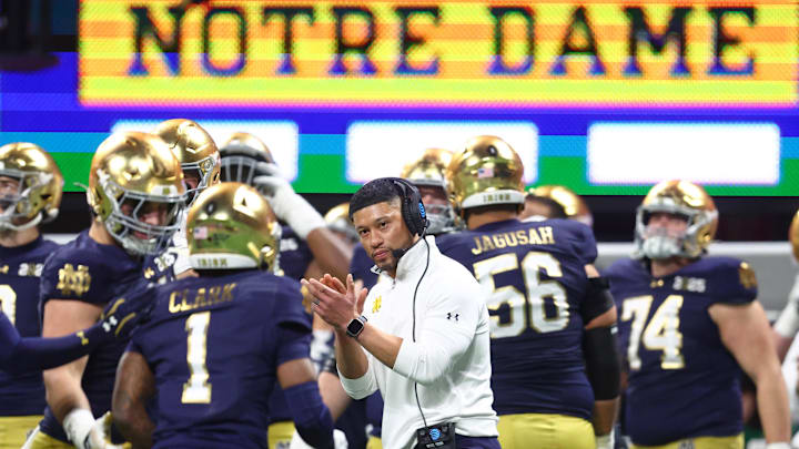 Jan 20, 2025; Atlanta, GA, USA; Notre Dame Fighting Irish head coach Marcus Freeman reacts after a play against the Ohio State Buckeyes during the second half the CFP National Championship college football game at Mercedes-Benz Stadium. Jan 20, 2025; Atlanta, GA, USA; Notre Dame Fighting Irish head coach Marcus Freeman reacts after a play against the Ohio State Buckeyes during the second half the CFP National Championship college football game at Mercedes-Benz Stadium.