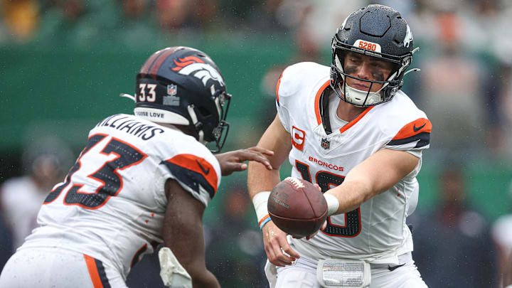 Denver Broncos quarterback Bo Nix (10) hands off to running back Javonte Williams. Denver Broncos quarterback Bo Nix (10) hands off to running back Javonte Williams.