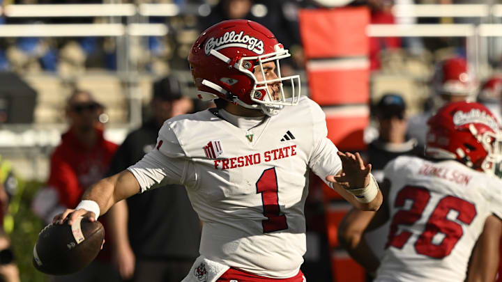 Nov 30, 2024; Pasadena, California, USA;  Fresno State Bulldogs quarterback Mikey Keene (1) throws a pass against the UCLA Bruins during the fourth quarter at Rose Bowl. Mandatory Credit: Robert Hanashiro-Imagn Images