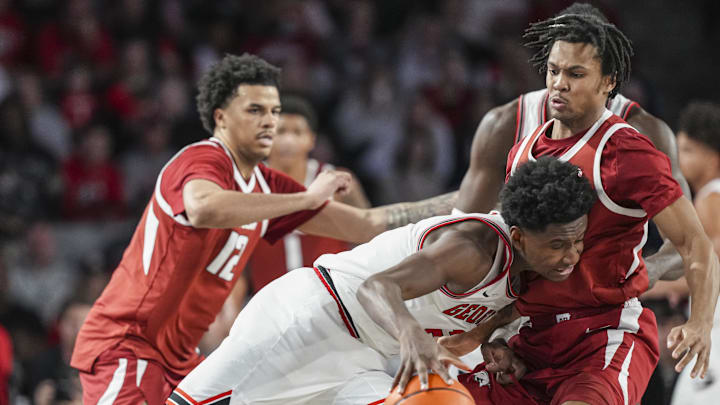 Jan 17, 2026; Athens, Georgia, USA; Georgia Bulldogs forward Kanon Catchings (6) collides with Arkansas Razorbacks guard D.J. Wagner (21) during the second half at Stegeman Coliseum. Mandatory Credit: Dale Zanine-Imagn Images