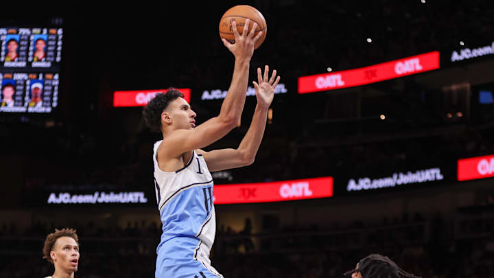 Mar 22, 2025; Atlanta, Georgia, USA; Atlanta Hawks forward Zaccharie Risacher (10) shoots against the Golden State Warriors in the second quarter at State Farm Arena. Mandatory Credit: Brett Davis-Imagn Images