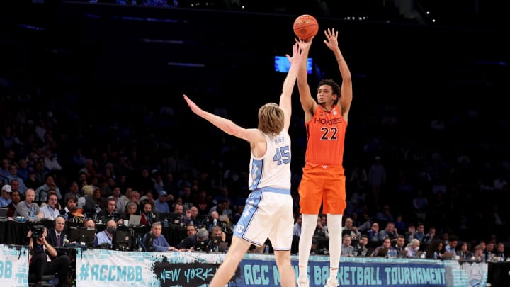 Mar 11, 2022; Brooklyn, NY, USA; Virginia Tech Hokies forward Keve Aluma (22) shoots a three point shot against North Carolina Tar Heels forward Brady Manek (45) during the second half of an ACC Tournament semifinal game at Barclays Center. Mandatory Credit: Brad Penner-USA TODAY Sports Mar 11, 2022; Brooklyn, NY, USA; Virginia Tech Hokies forward Keve Aluma (22) shoots a three point shot against North Carolina Tar Heels forward Brady Manek (45) during the second half of an ACC Tournament semifinal game at Barclays Center. Mandatory Credit: Brad Penner-USA TODAY Sports