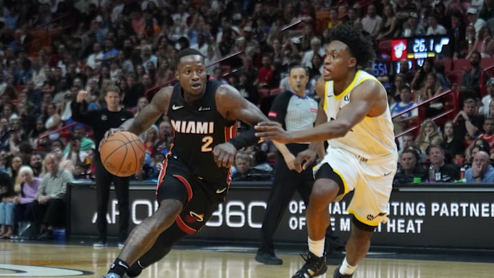 Mar 2, 2024; Miami, Florida, USA; Miami Heat guard Terry Rozier (2) drives to the basket as Utah Jazz guard Collin Sexton (2) defends in the second half at Kaseya Center. Mandatory Credit: Peter Joneleit-Imagn Images